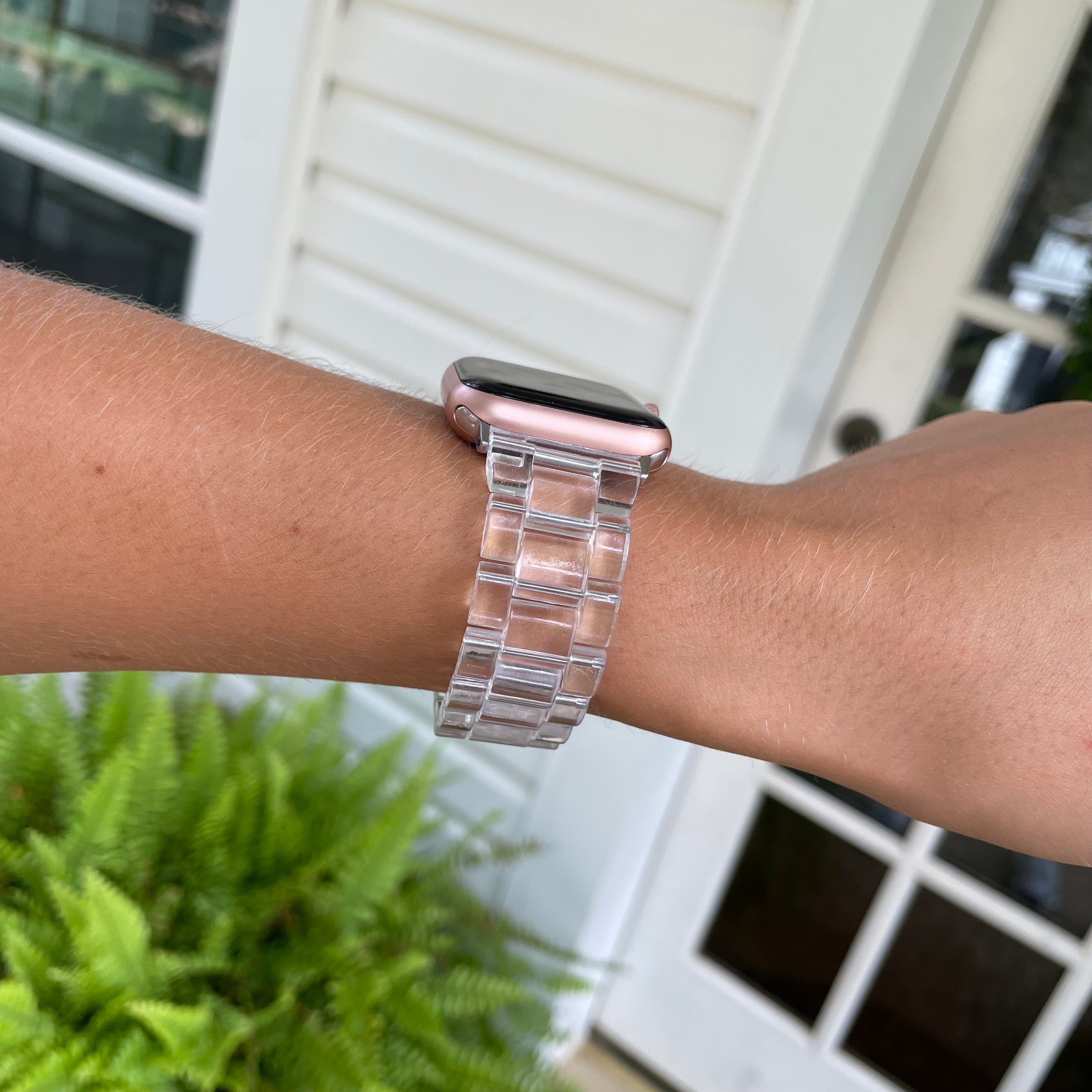 Clear Resin Apple Watch Band on wrist with Apple Watch.