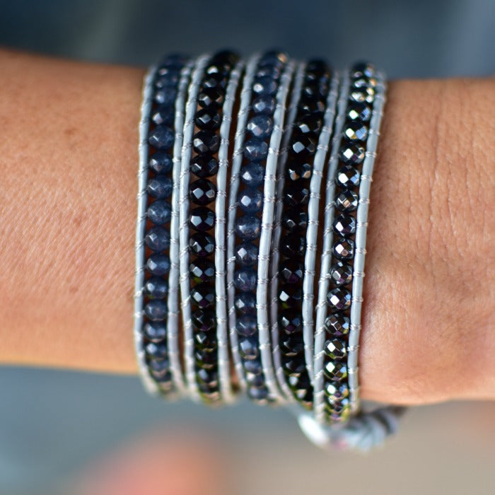 Black and Gray Stones on Gray Leather Wrap Bracelet on wrist.