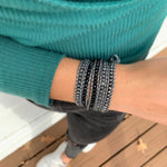 Black and Gray Stones on Dark Gray Leather Wrap Bracelet on wrist.