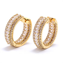 18K gold plated hoop earrings decorated with cubic zirconia on outside and inside of the hoop.