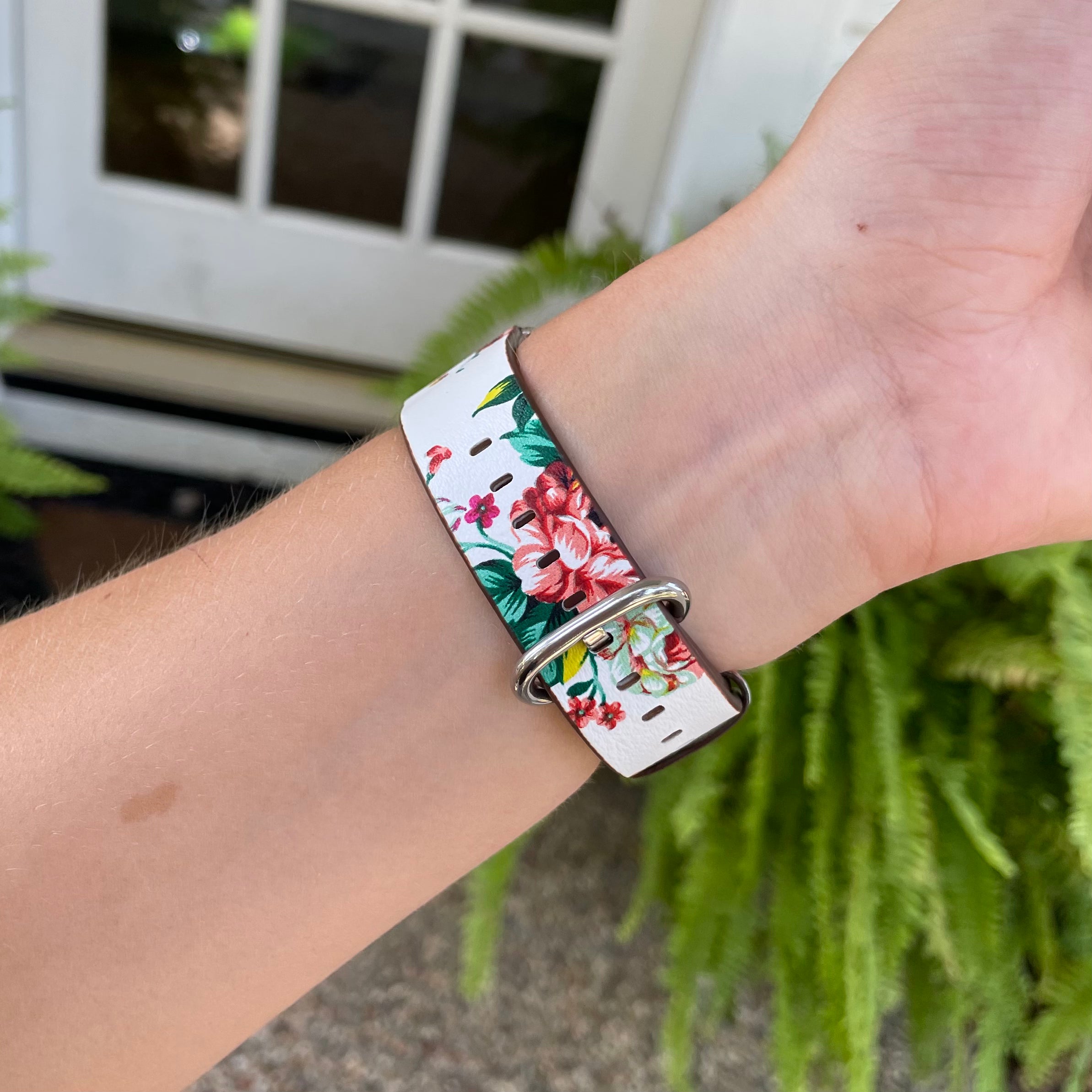 White Multi-Color Floral Print Apple Watch Band on Apple Watch on wrist.