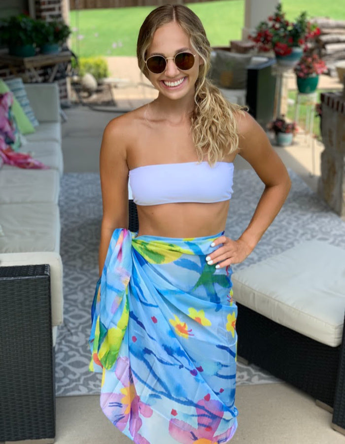 Blue sarong with yellow, green, and pink floral design.