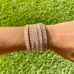 5 layer wrap bracelet with champagne leather, and clear crystals and neutral beads on wrist.