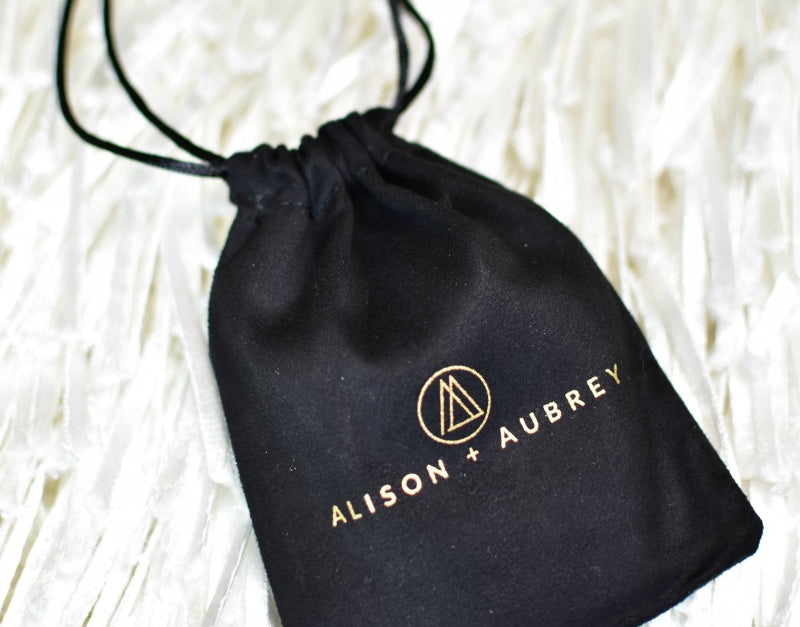 Alison + Aubrey black jewelry pouch that bracelet comes in.