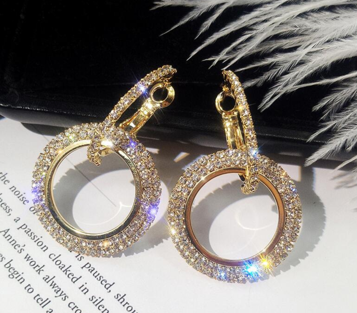 Gold double loop earrings with pave cubic zirconia.