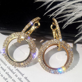 Gold double loop earrings with pave cubic zirconia.