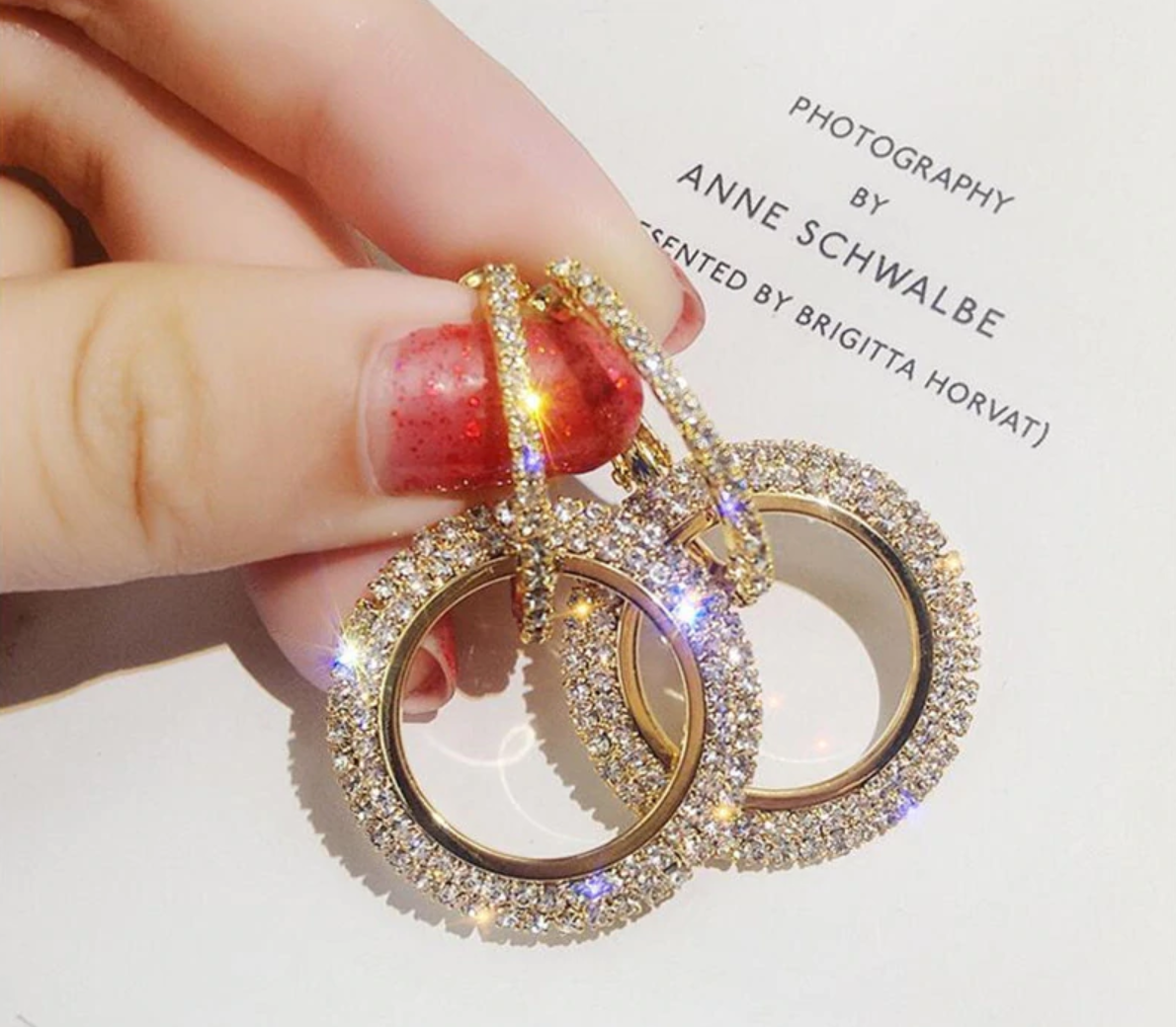 Gold double loop earrings with pave cubic zirconia.