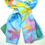 Blue scarf with yellow, green, and pink floral design.