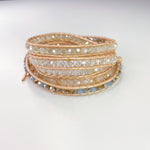 5 layer wrap bracelet with champagne leather, and clear crystals and neutral beads.